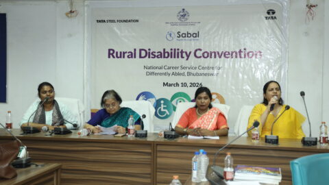 Panel of speakers. From left to right - Durgashri Sardeshpande, Smt. Katsuri Mohapatra, Jharana Mallick, and Nidhi Goyal. Nidhi is speaking into a mic.