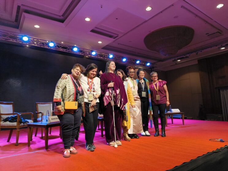 Group photo of plenary panelists, from left to right: Bishakha Datta, Lina Abou-Habib, Nidhi Goyal, Geetanjali Misra, Solome Nakaweesi, Sealing Cheng, Lydia Alpízar.