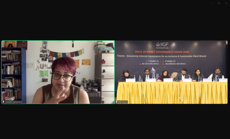 Screenshot from the panel. On the left is Srinidhi, who is speaking. On the right is the panel, where all the panelists are sitting on a podium listening. 