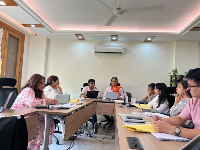 Shashank Pandey speaking at a roundtable with 6 other participants visible, some cut off, and Nidhi Goyal is sitting next to him.